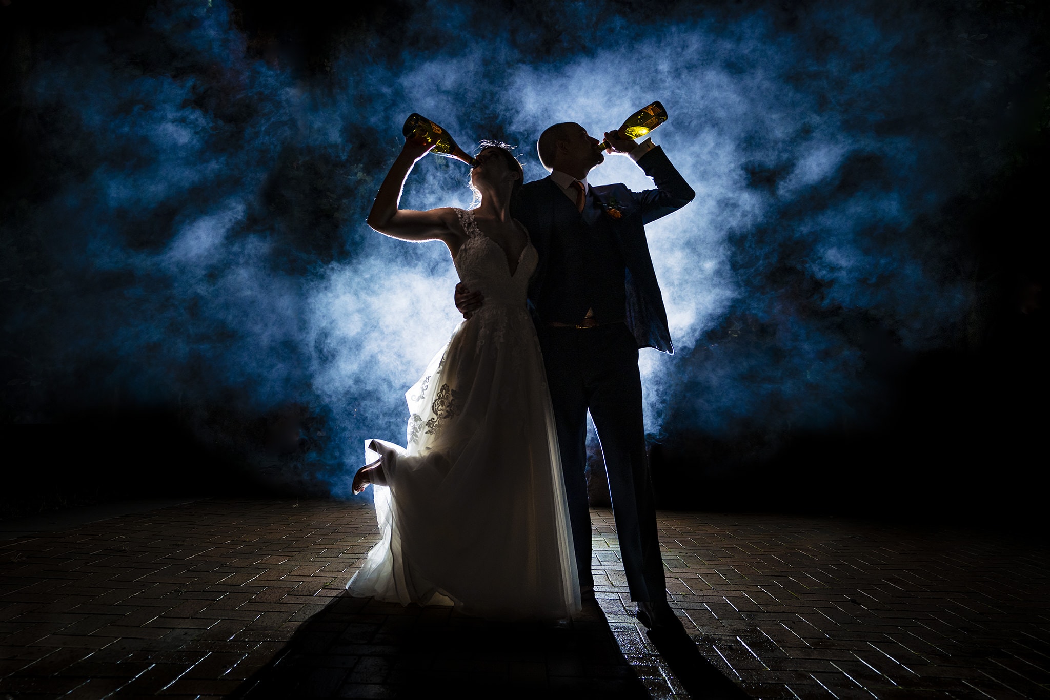 Couple drinks champagne at wedding reception