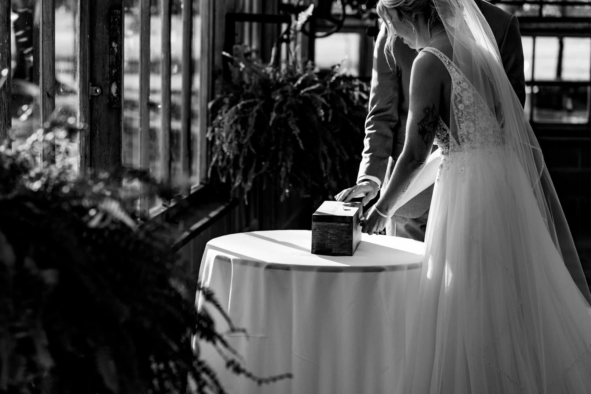 Couple locks wine box during wedding ceremony